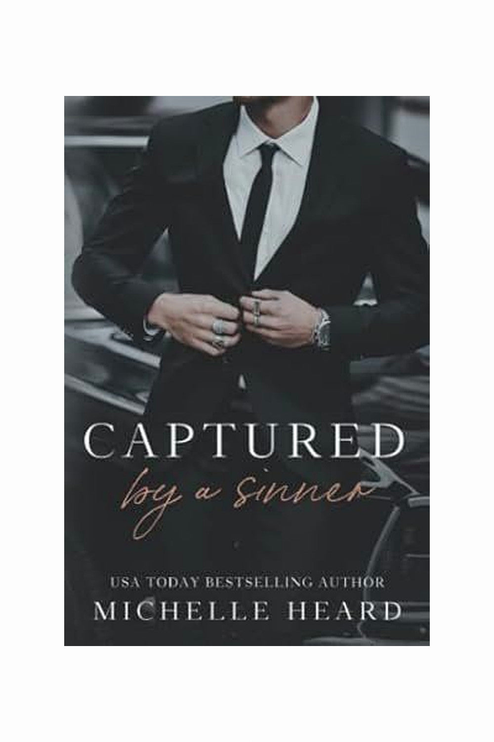Captured by a Sinner by Michelle Heard